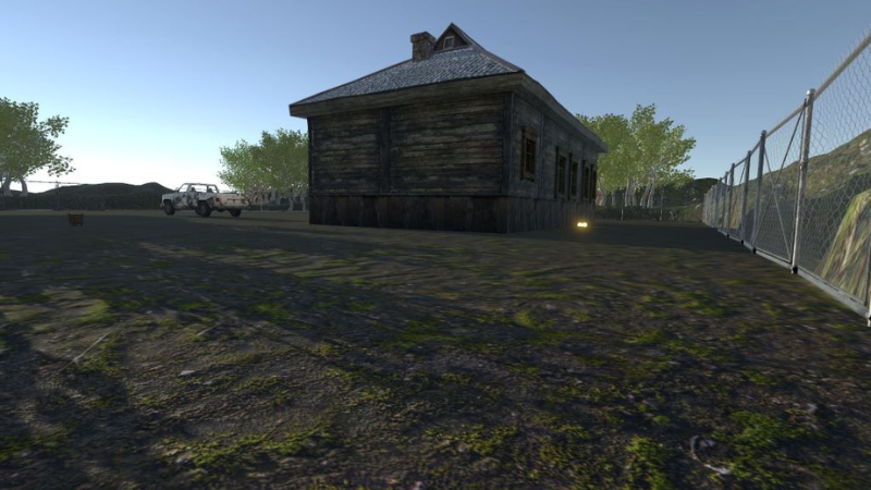 Glowing objects behind an old house in Unity.